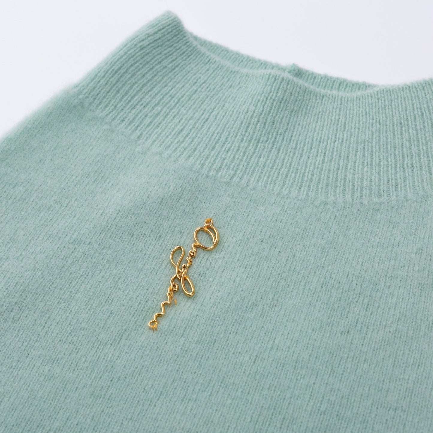 Sleeveless Jumper with Golden Metal Logo